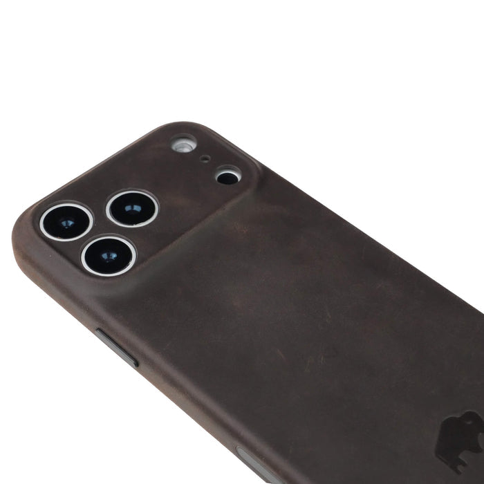 The Ryker Distressed Coffee full-grain leather iPhone 17 Pro Max MagSafe case covers the entire camera plateau.