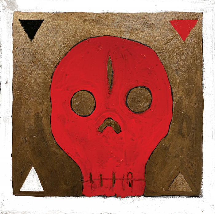 The cover of "The Reverb Conspiracy - Volume 7" features a red skull with hollow eyes and a dark vertical mark, centered on textured gold with black, red, and white triangles in the corners, reflecting the bold international psych scene style.
